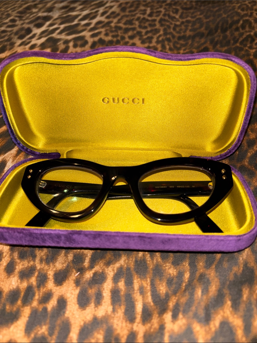 Gucci Black Cat-Eye Glasses With Yellow And Purple Case